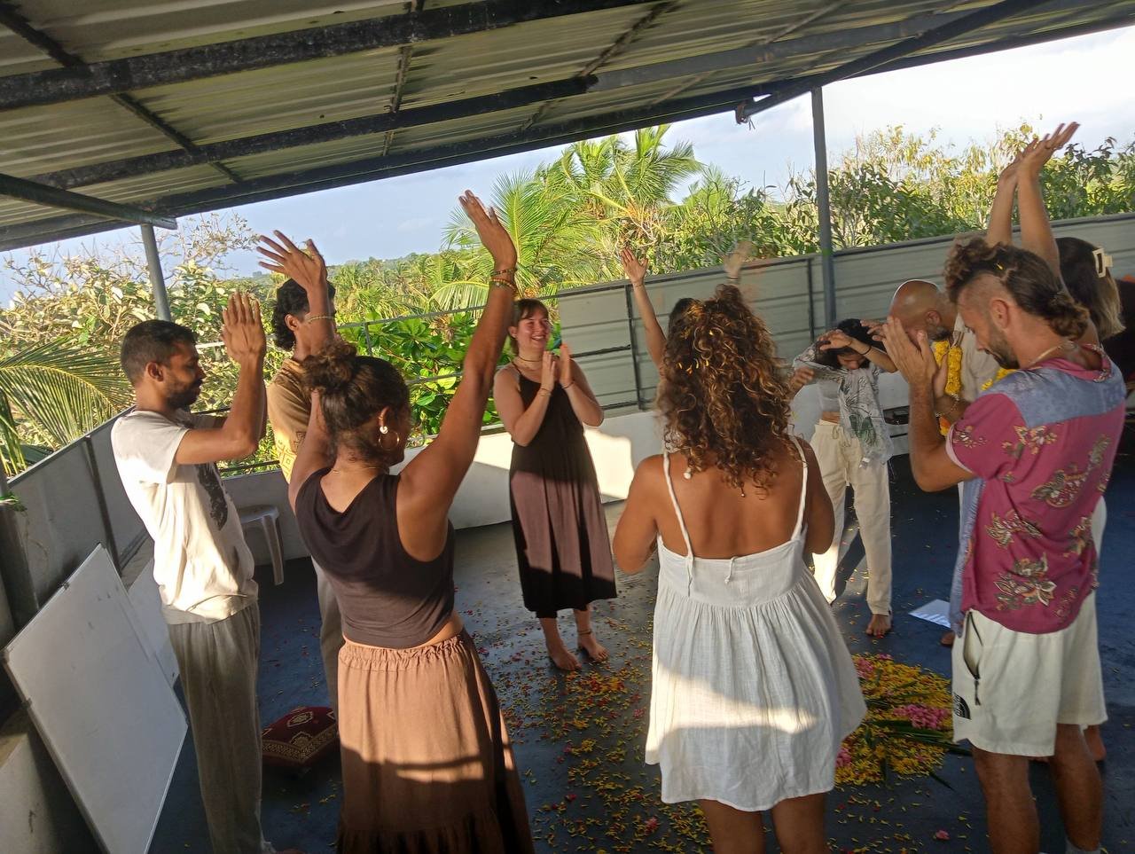 Students practicing yoga at Yogakulam Academy