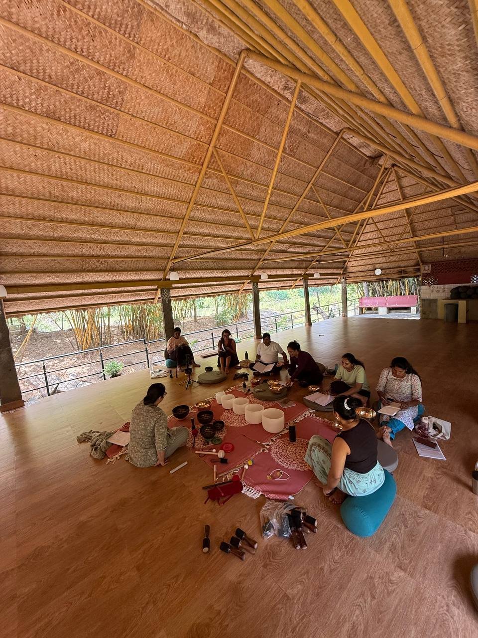 Students practicing yoga at Yogakulam Academy