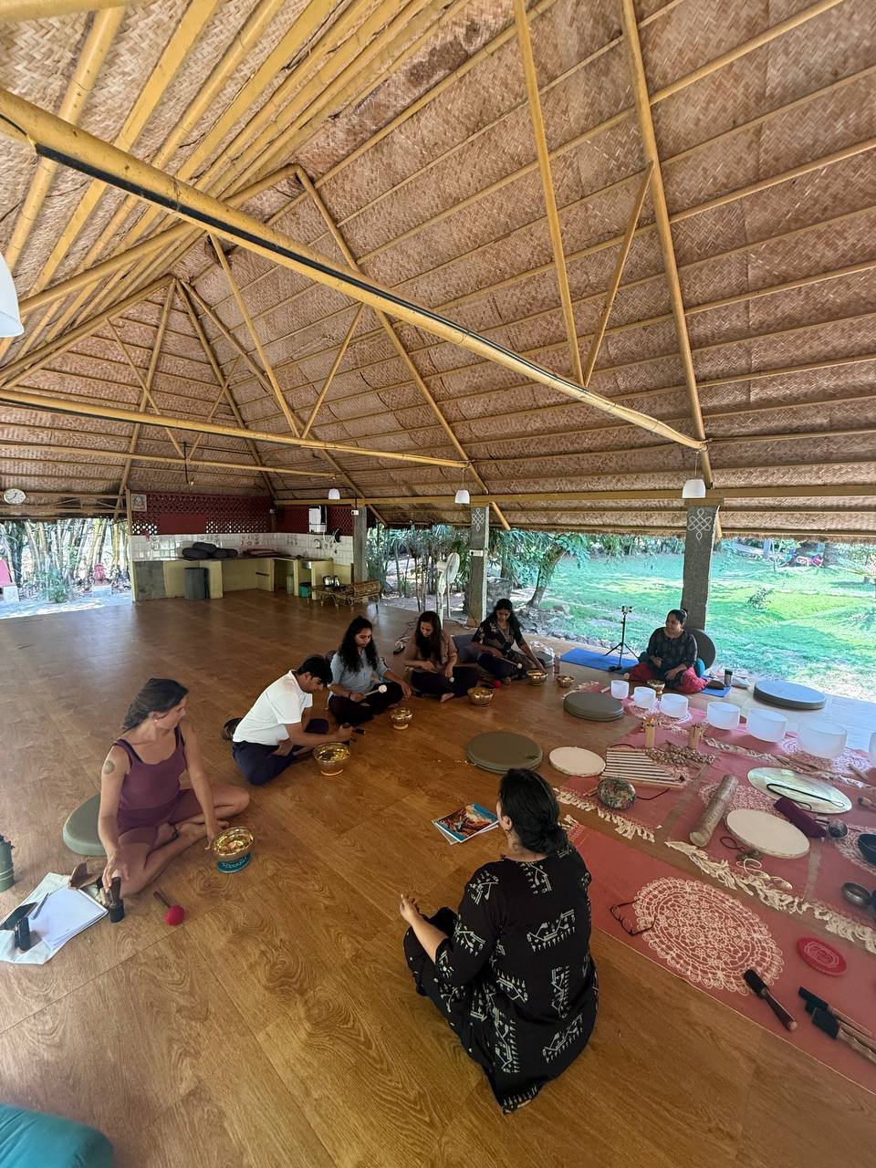 Students practicing yoga at Yogakulam Academy