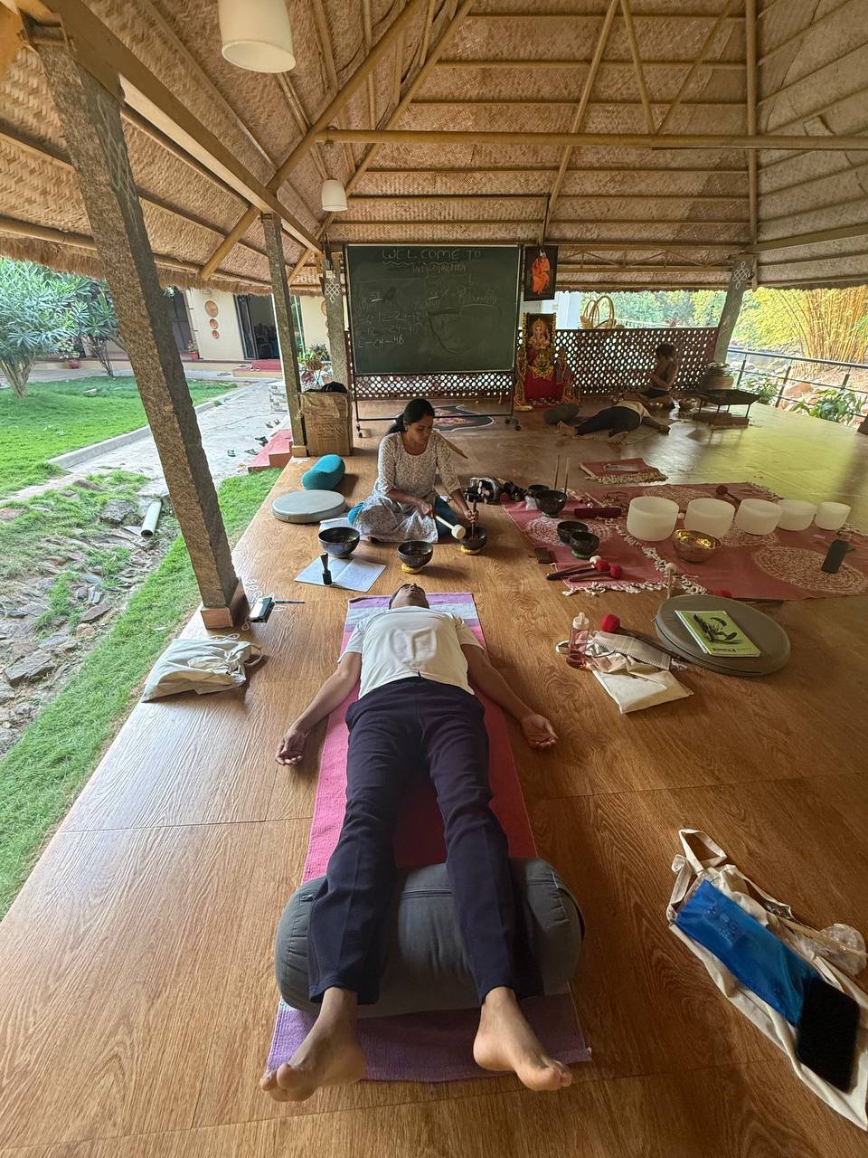 Students practicing yoga at Yogakulam Academy