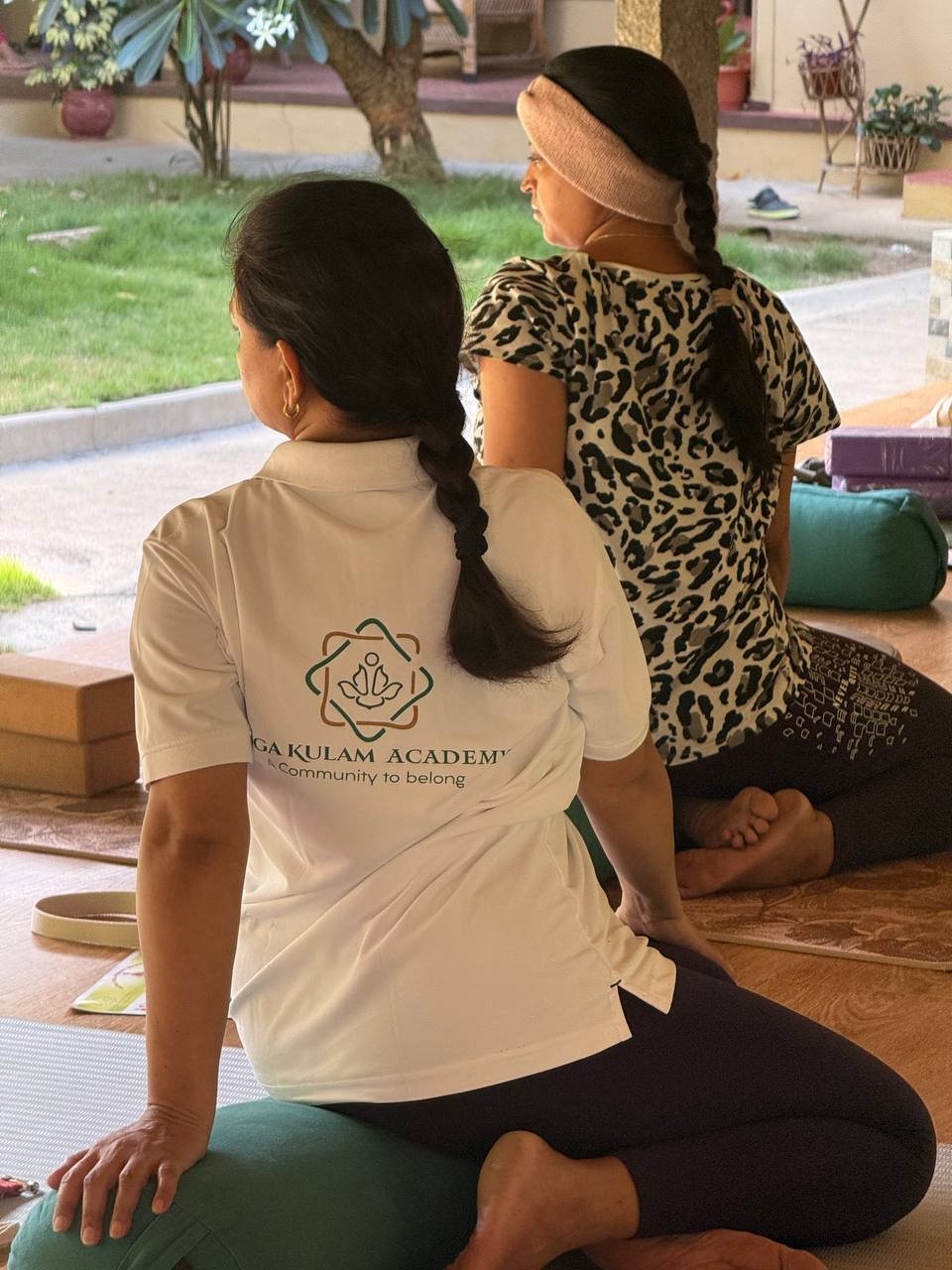 Students practicing yoga at Yogakulam Academy