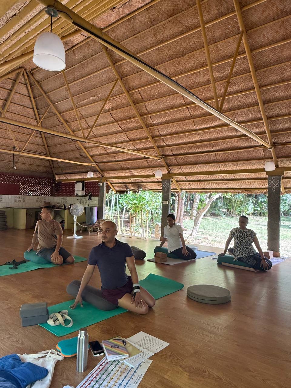 Students practicing yoga at Yogakulam Academy