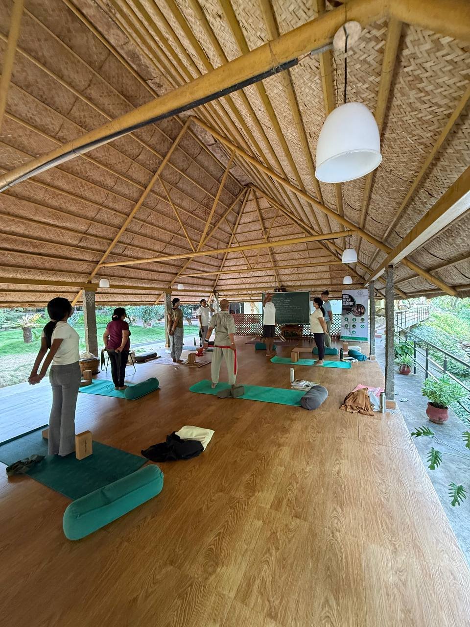 Students practicing yoga at Yogakulam Academy